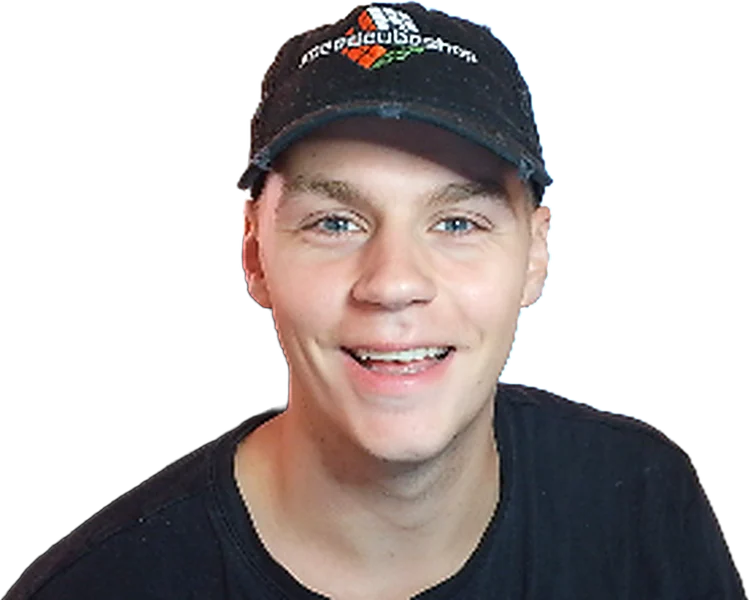 Jesse smiling in a SpeedCubeShop cap